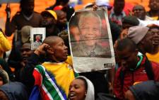 Crowds gather at the FNB Stadium for a memorial service for former South African President Nelson Mandela on 10 December 2013. Picture: Werner Beukes/Sapa/Mandela Pool
