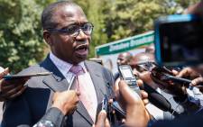 FILE: Minister of Finance and Economic Development Professor Mthuli Ncube speaks to the press after the swearing-in ceremony for Zimbabwe's new cabinet ministers at State House, Harare, on 10 September 2018. Picture: AFP.