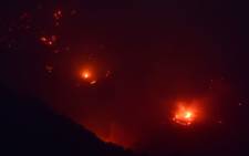 Fire burns on a hillside at the Thomas Fire, 16 December 2017 in Montecito, California. Picture: AFP