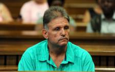 Johan Kotze appears in the North Gauteng High Court on Tuesday, 20 November 2012. He's accused of orchestrating the gang-rape of his ex-wife and of killing his stepson. Picture: Werner Beukes/SAPA.