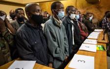 Fifty-three military veterans accused of holding ministers Thandi Modise, Mondli Gungubele and deputy minister Thabang Makwetla against their will appeared in court on 19 October 2021 for bail applications. Picture: Pool/Jacques Nelles