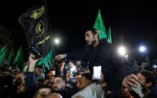 Newly released prisoners are surrounded by supporters during a welcome ceremony following the release of Palestinian prisoners from Israeli jails in exchange for Israeli hostages held by Hamas, in Ramallah early on 30 November 2023. Picture: AFP