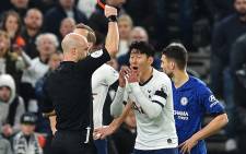 Referee Anthony Taylor (L) shows a red card to Tottenham Hotspur's Son Heung-Min during the English Premier League football match between Tottenham Hotspur and Chelsea at Tottenham Hotspur Stadium in London, on 22 December 2019. Picture: AFP