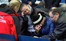 Relatives of the victims of the airplane crash speak with a Russian Emergency psychologist (L) at the airport in Rostov-on-Don on March 19, 2016. All sixty-two people on board a flydubai Boeing 737 were killed when the plane crashed and burst into flames as it was landing in Rostov-on-Don, in Southern Russia, on Saturday morning, officials said. The plane was making its second attempt to land in bad weather when it missed the runway, erupting in a huge fireball as it crashed and leaving debris scattered across a wide area. Picture: AFP.