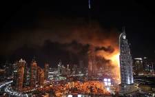 Fire engulfs a 63-storey skyscraper in Dubai on New Year's Eve 31 December 2015. Picture: @Uber_Pix via Twitter.