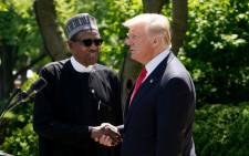  US President Donald Trump and Nigeria's President Muhammadu Buhari shake hands as they take part in a joint press conference in the Rose Garden of the White House on 30 April, 2018 in Washington, DC. Picture: AFP.