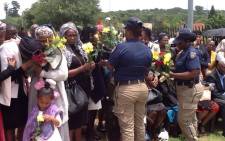 Emotional scenes as family and JMPD colleagues say goodbye at the scene of a crash in Fourways. Picture: Mia Lindeque/EWN
