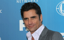 FILE: US actor John Stamos attends the 2015 FOX programming presentation at Wollman Rink in Central Park on 11 May, 2015 in New York City. Picture: AFP.