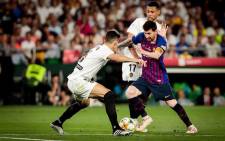 Barcelona's Lionel Messi takes on two Valencia defenders in the Copa del Rey final on 25 May 2019. Picture: @FCBarcelona/Twitter