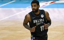 In this file photo, Kyrie Irving #11 of the Brooklyn Nets runs the court during the fourth quarter of their game against the Charlotte Hornets at Spectrum Center on 27 December 2020 in Charlotte, North Carolina. Picture: AFP