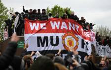 Supporters protest against Manchester United's owners, outside English Premier League club Manchester United's Old Trafford stadium in Manchester, north-west England on 2 May 2021, ahead of their English Premier League fixture against Liverpool. Picture: Oli Scarff/ AFP