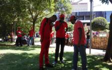 A few of Communication Workers Union (CWU) member waiting outside the Cosatu house ahead of their march today, against what it says is the alarming level of incompetence and maladministration at the South African Post Office on 29 October 2015. Picture: Kgothatso Mogale/EWN.