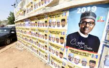 FILE: Placards with the ruling All Progressives Congress (APC), Nigerian President Mohammadu Buhari, are displayed during a campaign rally at the Sanni Abacha Stadium in Kano, on 31 January 2019. Picture: AFP