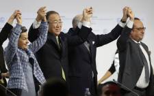 FILE: (L-R) Executive Secretary of the United Nations Framework Convention on Climate Change (UNFCCC) Christiana Figueres, Secretary General of the United Nations Ban Ki Moon, Foreign Affairs Minister and President-designate of COP21 Laurent Fabius, and France's President Francois Hollande raise hands together after adoption of a historic global warming pact at the COP21 Climate Conference in Le Bourget, north of Paris, on December 12, 2015. Envoys from 195 nations on December 12 adopted to cheers and tears a historic accord to stop global warming. Picture: AFP