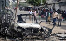 FILE: The site of a major car bomb and gun attack against an intelligence headquarters and detention facility in the centre of Mogadishu, which police said left at least seven militants dead on 31 August 2014. Picture: AFP.