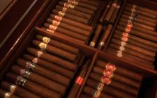 FILE: Dozens of Cuban cigars inside a temperature-controlled room at a cigar club. Picture: AFP.