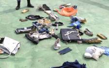 An image grab taken from a video uploaded on the official Facebook page of the Egyptian military spokesperson on May 21, 2016 and taken from an undisclosed location reportedly shows some debris that the search teams found in the sea after the EgyptAir Airbus A320 crashed in the Mediterranean. The Egyptian military spokesman released pictures on his Facebook page of some of the wreckage it recovered so far, including a safety vest and what appeared to be the shredded remains of a seat. EgyptAir flight MS804 sent automated messages signalling smoke onboard before plunging into the Mediterranean, the French aviation safety agency said, as search teams hunted for more wreckage. Picture: Egyptian military spokesperson's facebook page/AFP.