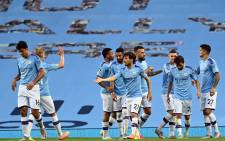 Manchester City midfielder David Silva (C) celebrates scoring the fourth goal during the English Premier League football match between Manchester City and Burnley at the Etihad Stadium in Manchester, north west England, on 22 June 2020. Picture: AFP