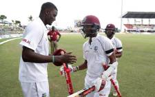West Indies captain Jason Holder celebrates a Test win with teammates. Picture: Twitter.