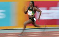 FILE: Jamaica's Elaine Thompson competes in the athletics women's 200m semi-final during the 2018 Gold Coast Commonwealth Games at the Carrara Stadium on the Gold Coast on 11 April 2018. Picture: AFP
