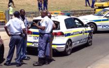 FILE: Police gather more evidence at the scene where they accosted armed robbers near the N1 north on 30 October 2014. Picture: @crimeairnetwork.