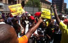 Students, parents and workers from the University of Johannesburg gather outside the court singing and dancing as they wait for missing dockets to be found, which will allow for court proceedings to eventually start on 9 November 2015. Picture: Kgothatso Mogale/EWN.