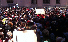 UCT #FeesMustFall protesters singing and dancing outside the Cape Town Magistrates Court. There is a heavy police presence. Picture: Anthony Molyneaux/EWN.