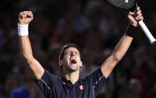 Serbia's Novak Djokovic celebrates his victory against Canada's Milos Raonic at the ATP World Tour Masters. Picture: AFP.