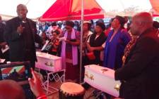 Mourners gather around the tiny coffins of Yonelisa and Zandile Mali on 19 October 2013. The young cousins were found raped and murdered in Diepsloot earlier in the week. Picture: Lesego Ngobeni/EWN