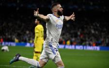 Real Madrid's French forward Karim Benzema celebrates after scoring a goal during the UEFA Champions League quarterfinal second leg football match between Real Madrid CF and Chelsea FC at the Santiago Bernabeu stadium in Madrid on 12 April 2022. Picture: PIERRE-PHILIPPE MARCOU/AFP