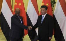 Chinese President Xi Jinping (R) shakes hands with Sudanese President Omar al-Bashir before their meeting at the Great Hall of the People in Beijing on 1 September 2015. Al-Bashir is in Beijing to attend Chinas huge military parade on 3 September marking Japan's defeat in World War II. Picture: AFP.