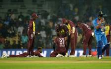 Indian cricketer Manish Pandey (R) walks past as West Indies cricketers reacts after losing the third T20 cricket match between India at the MA Chidambaram Cricket Stadium in Chennai on 11 November 2018. Picture: AFP