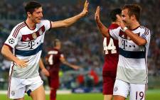 Robert Lewandowski and Mario Götze of Bayern Munich celebrate after their 7-0 hammering of AS Roma in the Uefa Champions League group game on 21 October 2014. Picture: Official Uefa Facebook page.
