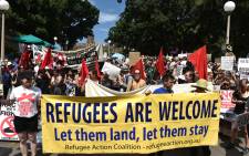 Protestors march on the streets of Sydney’s central business district against US President Donald Trump’s travel ban policy on 4 February, 2017. Picture: AFP