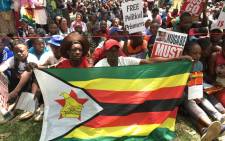Crowds of Zimbabweans gather at the African Unity Square opposite Parliament on 21 November 2017 as they await impeachment proceeding against Robert Mugabe. Picture: EWN