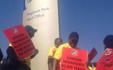 The National Union of Mineworkers (NUM) members protest outside Eskom offices in Morningside, northern Johannesburg on 4 August 2014 against essential services designation of Eskom staff. Picture: Govan Whittles/EWN.