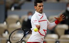 FILE: Serbia's Novak Djokovic returns the ball to Sweden's Mikael Ymer during their men's singles first round tennis match at the Philippe Chatrier court on Day 3 of The Roland Garros 2020 French Open tennis tournament in Paris on 29 September 2020. Picture: AFP