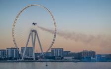 A handout picture released by the Expo 2020 on 17 February 2020, shows Vince Reffet, known as Jetman, taking part in a flight in the Emirati city of Dubai. Picture: AFP