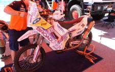 A technician takes a look at Riaan Van Niekerk’s motorcycle ahead of another day of competition in the 2014 Dakar Rally. Picture: Derek Alberts/EWN Sport