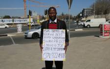 FILE: Thembinkosi Pakithi is a Public Relations graduate seeking employment by putting himslef out there standing on a street corner. Picture Phumlani Pikoli/EWN