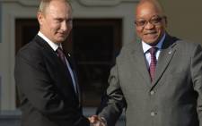 FILE: Russian President Vladimir Putin welcomes South African President Jacob Zuma to a summit in Saint Petersburg, Russia. Picture: AFP
