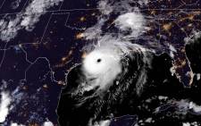 This RAMMB/NOAA satellite image shows Hurricane Laura reaching the coasts of Louisana and Texas on August 26, 2020 at 19H20 Pacific time, (02:20UTC 27 August 2020). Picture: AFP