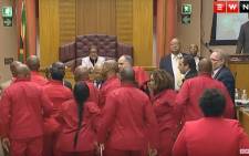 EFF MPs are thrown out during Pravin Gordhan's Public Enterprises budget vote. Picture: EWN YouTube.