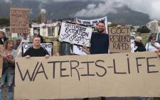 Members of Save Water and Stop COCT express their concerns about the City of Cape Town’s water and electricity tariff proposals. Picture: Kaylynn Palm/EWN.
