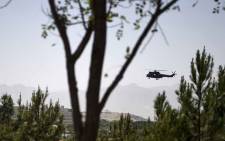 A US military helicopter is seen flying towards the Green Zone in Kabul on 3 August 2019, as new talks between the US and the Taliban continue. Washington is hoping for a breakthrough as talks between the US and the Taliban resumed in Doha on 3 August in a bid to end 18 years of war in Afghanistan. Picture: AFP