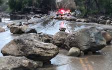 Rocks block the Hot Springs Road in Montecito following debris and mud flow due to heavy rain falls in Montecito, California, on 9 January, 2018. Picture: AFP