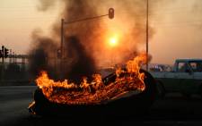 FILE: A tyre burns during a protest in Ennerdale, south of Johannesburg. Picture: Christa Eybers/EWN.