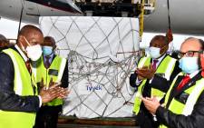 Health Minister Zweli Mkhize, Deputy President David Mabuza, President Cyril Ramaphosa and Deputy High Commissioner of India Abhijit Chakraborty celebrate the arrival of the first million doses of the AstraZeneca COVID-19 vaccine at OR Tambo International Airport on 1 February 2021. Picture: GCIS.