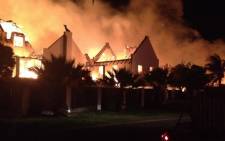 Houses ablaze in St Francis Bay on 11 November 2012. Picture: Supplied.