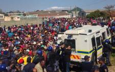 Thousands of people gather outside the Theewaterskloof Municipal offices in Grabouw during protests in the area on 15 September, 2014. Picture: Lauren Isaacs/EWN. 
